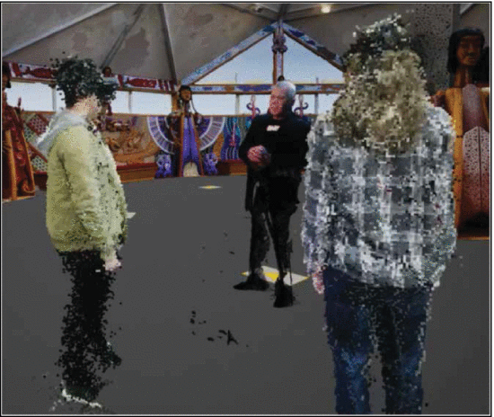 Figure 2. - Researchers Noel Park (left) and Stuart Duncan (right), each at different locations, interacting with a recording of kaumatua (elder) Bubba Thompson (center) in the Ātea Presence system.